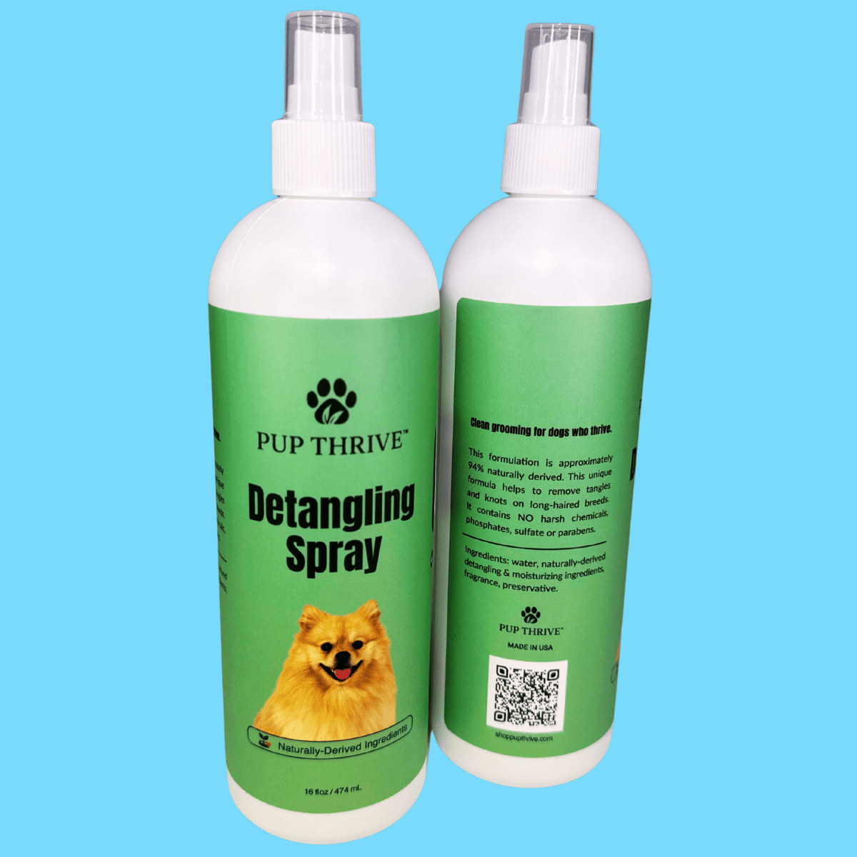 Two bottles of Pup Thrive Detangling Spray on a blue background