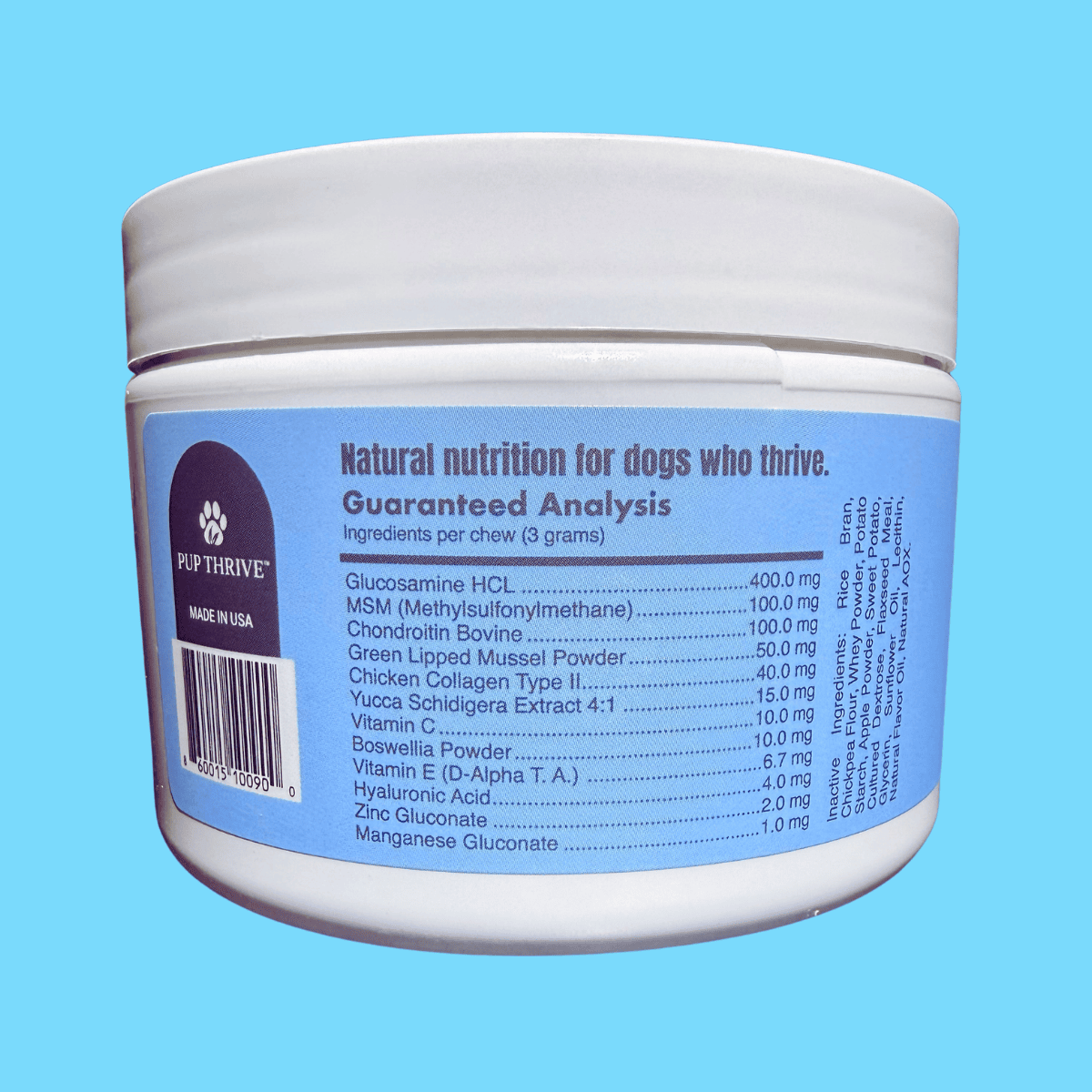 Container of dog supplement with label on a blue background